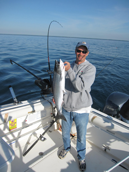 Greg Petrich with King Salmon - Leprechaun Fishing Charters on Lake Michigan