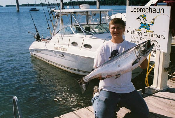 Garett Muonio with 25 lb King Salmon - Leprechaun Fishing Charters on Lake Michigan