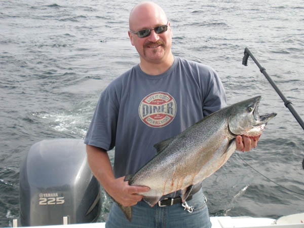 Jerry and first big King - Leprechaun Fishing Charters on Lake Michigan