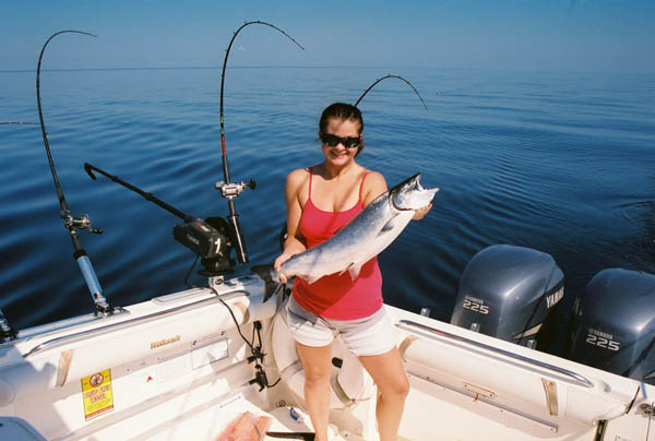 Kassie with King Salmon - Leprechaun Fishing Charters on Lake Michigan