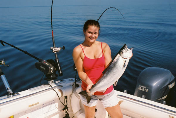 Kassie with a King Salmon - Leprechaun Fishing Charters on Lake Michigan