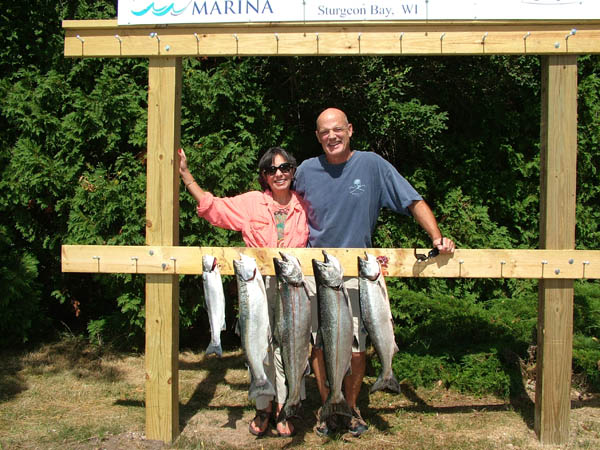 Tom and Nilka with their fish - Leprechaun Fishing Charters on Lake Michigan