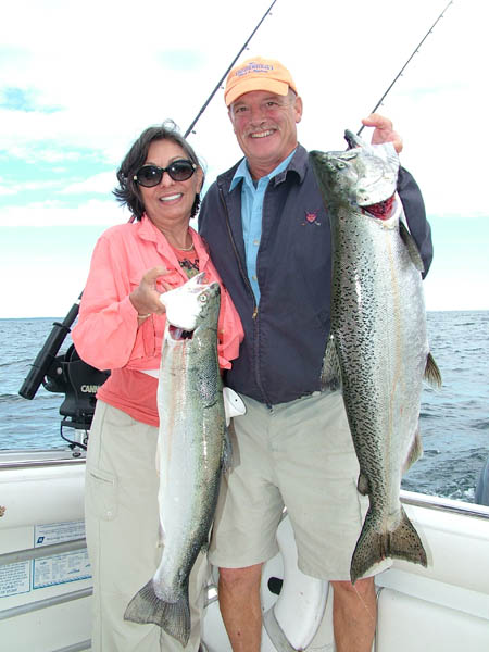 Tom and Nilka with Steelhead and King - Leprechaun Fishing Charters on Lake Michigan